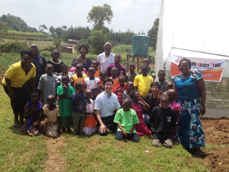 Group photo with children and local partners during a JAT-related activity in Kenya